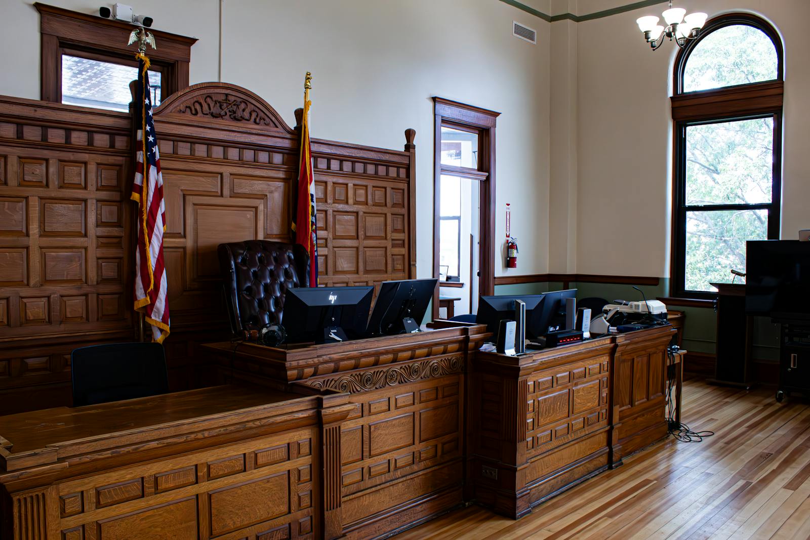 Formal hearing room with judge's bench and wooden seating